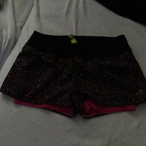 The shorts have a spandex liner and a polyester outside.